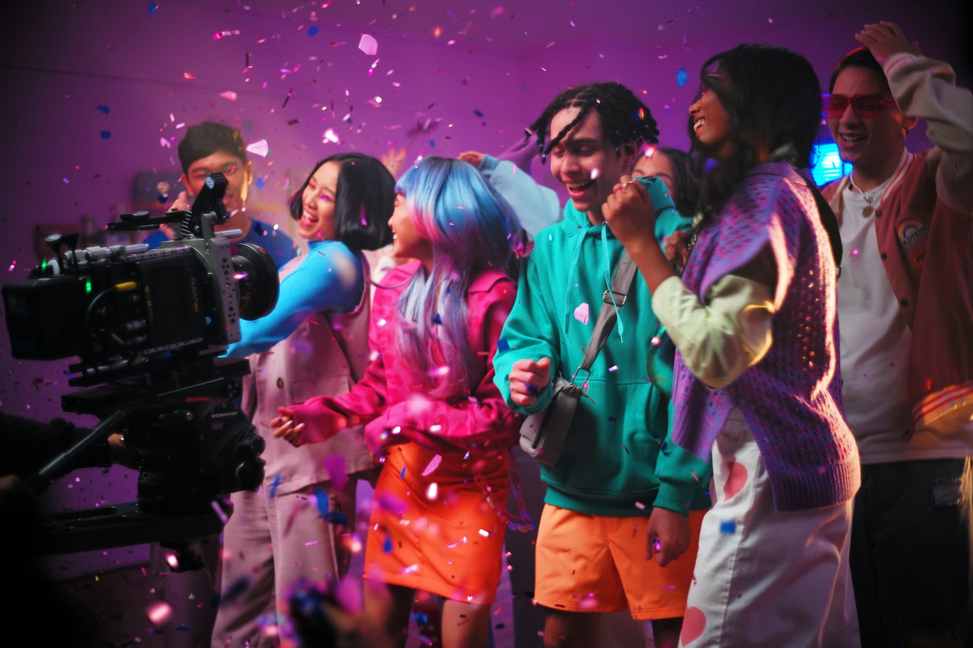 Guests dancing in confetti while being filmed on video